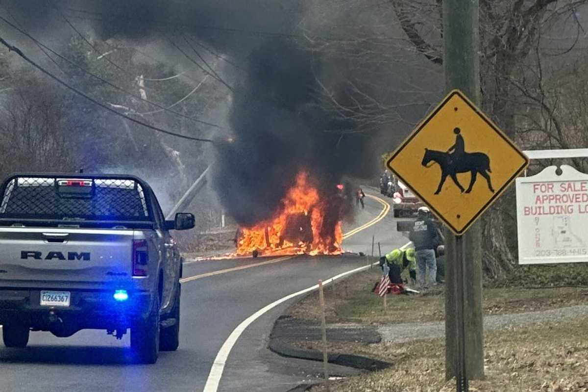 Neighbors pull woman from burning car with seconds to spare