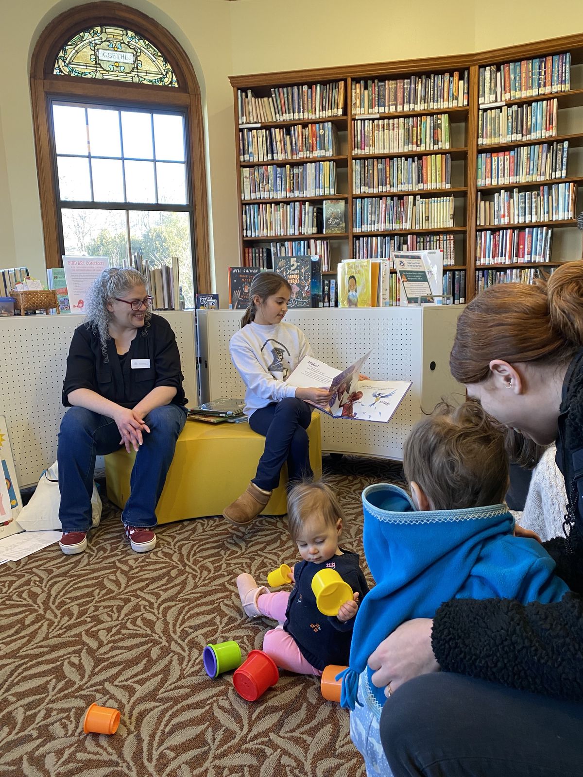 Children brought their parents to The Hotchkiss Library on Saturday
