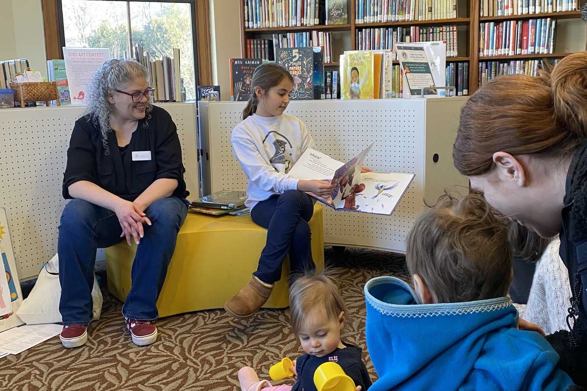 Children brought their parents to The Hotchkiss Library on Saturday