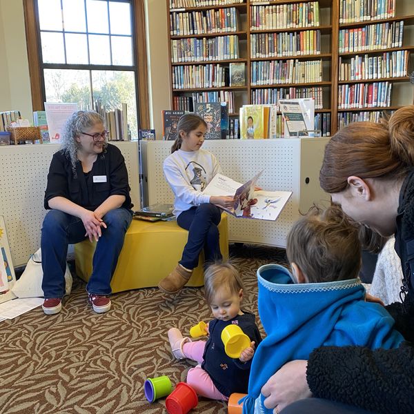 Children brought their parents to The Hotchkiss Library on Saturday