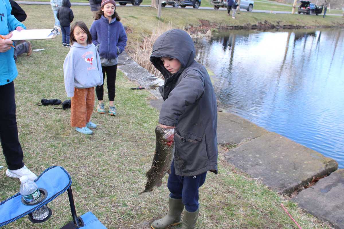 Young anglers reel in rainbow trout at children’s fishing derby