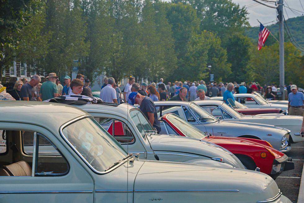 Crowds gather to get a close-up look at the classic cars that participated in the parade