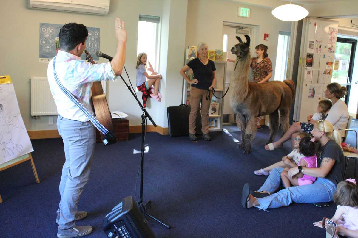 Songs, sketches and a llama delight children at Scoville Memorial Library