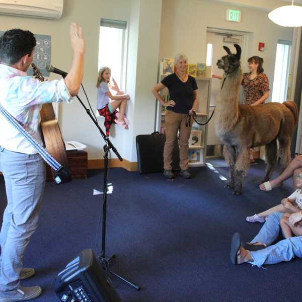 Songs, sketches and a llama delight children at Scoville Memorial Library