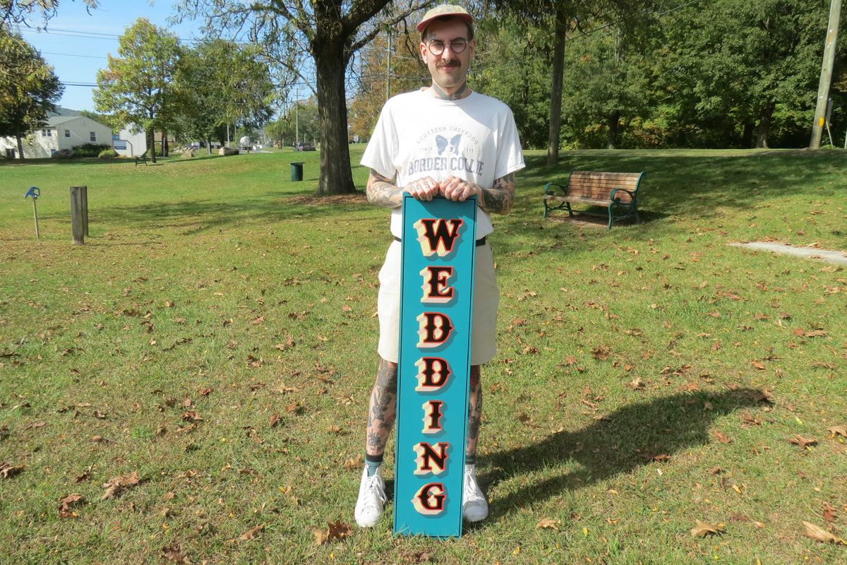 Area signmaker revives brush-and-board branding