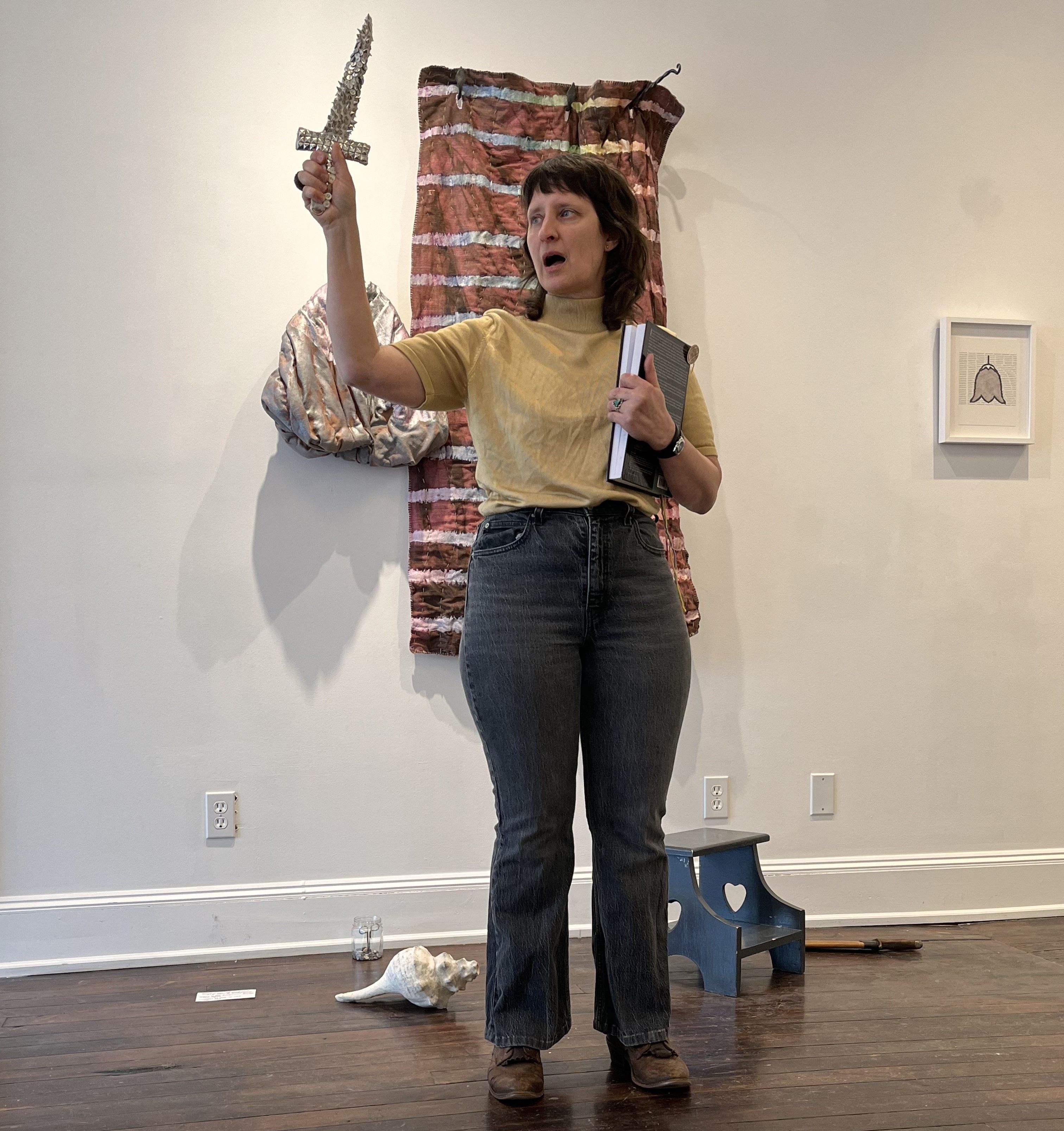 In her hand, a silver dagger