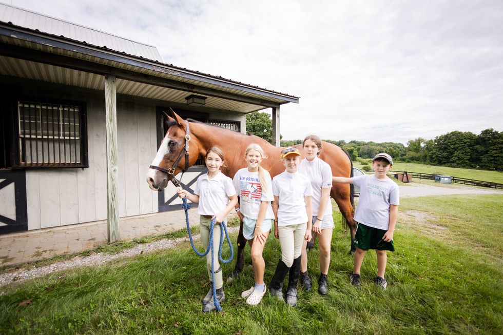 Kids pose with horse