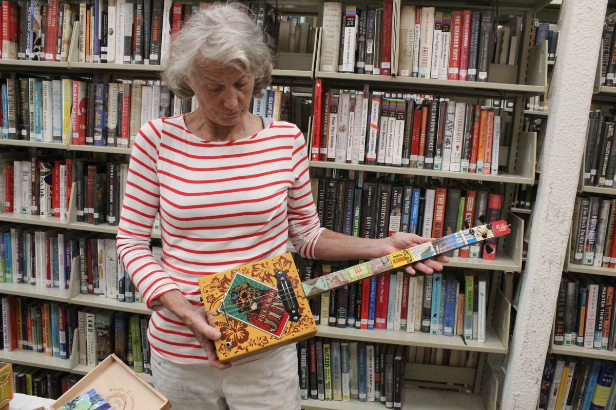 Painting cigar boxes at David M. Hunt Library