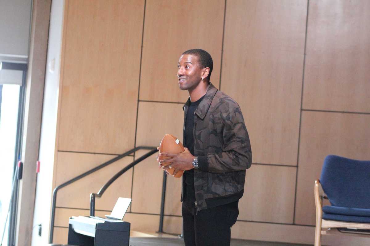 Super Bowl champ Malcolm Mitchell tells students how he learned to read