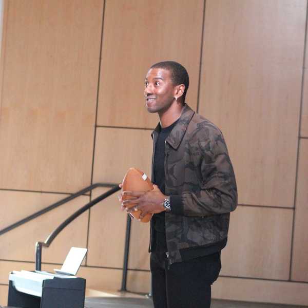 Super Bowl champ Malcolm Mitchell tells students how he learned to read