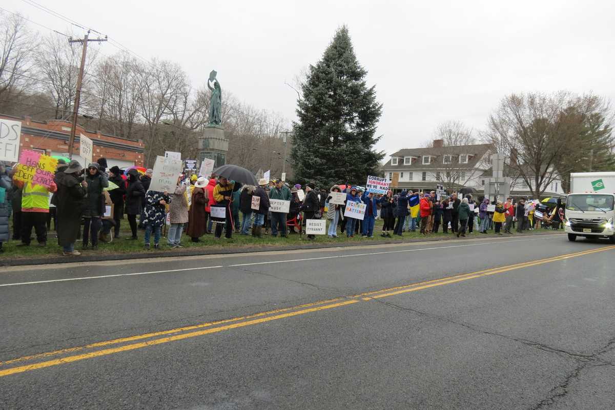 Political protests draw hundreds despite downpour