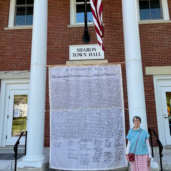 Life-sized Declaration of Independence hangs outside of Sharon Town Hall