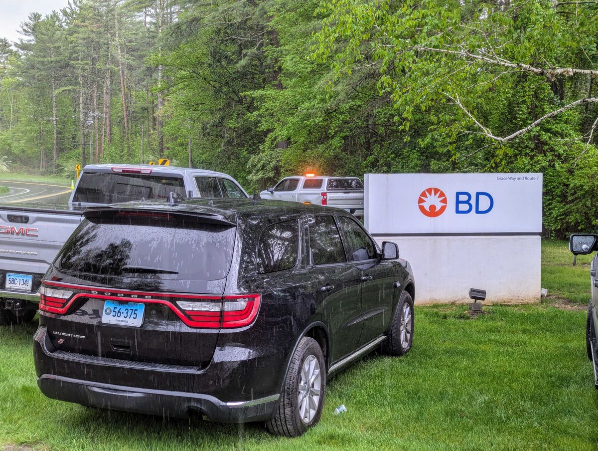 BD employees decontaminating after hazmat incident