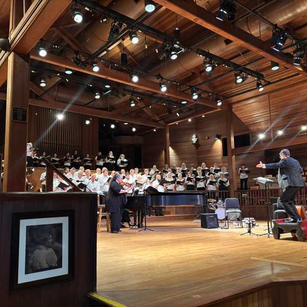Annual choral performance probes the nation’s identity with bluegrass and a call for tolerance