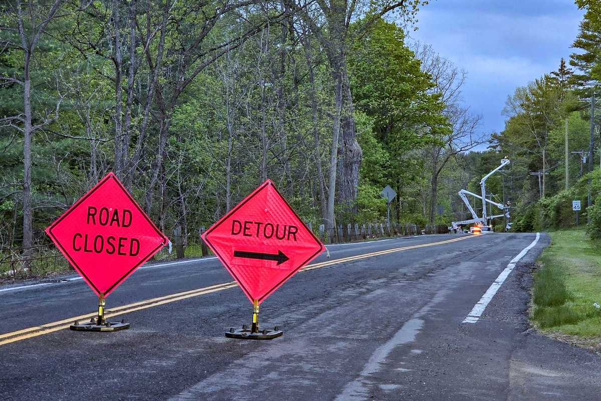 Van strikes utility pole, closes Route 112 for hours