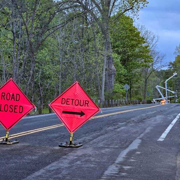 Van strikes utility pole, closes Route 112 for hours
