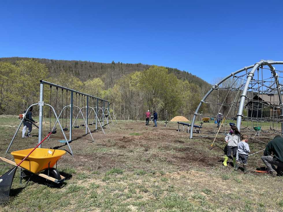 A playground made lovelier with some trees
